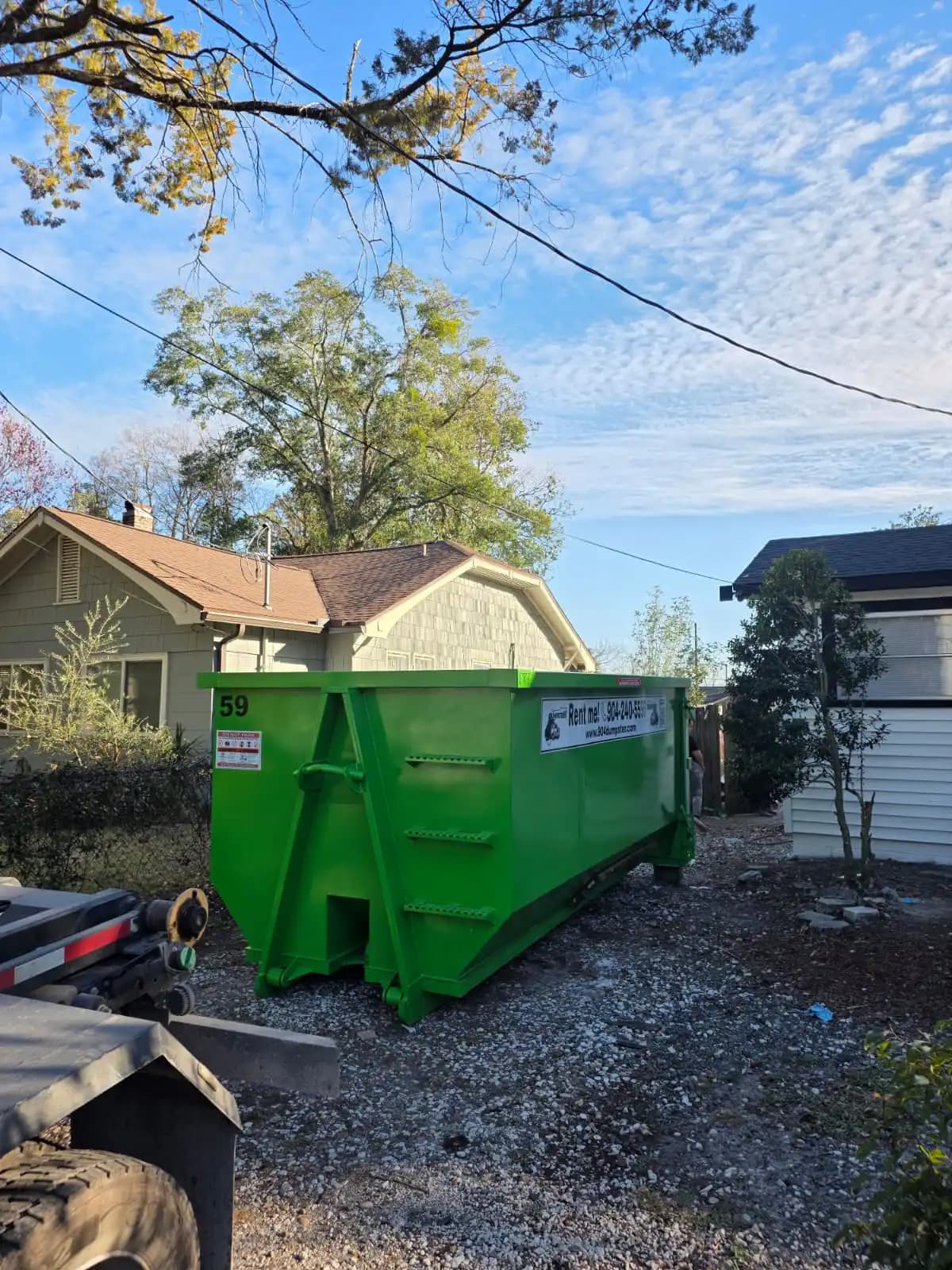 Residential dumpster rental in Jacksonville FL Residential roll-off container placed in the side yard of a Jacksonville home for a cleanout project